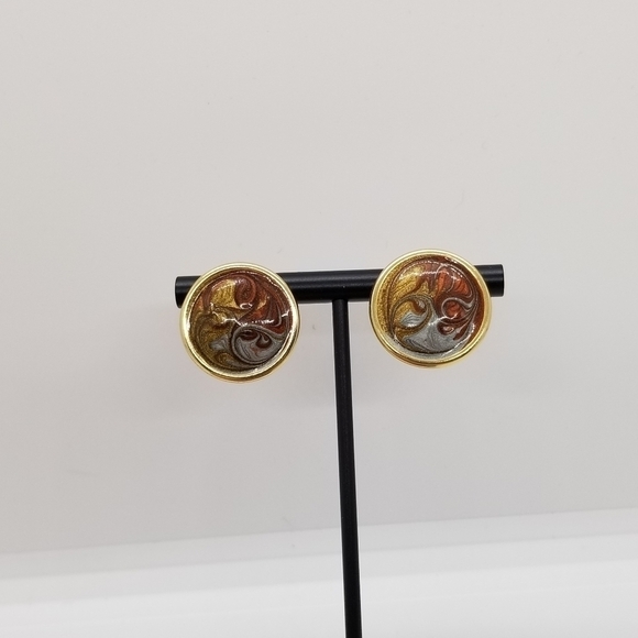 Jewelry - gold tone circular earrings with metallic swirls